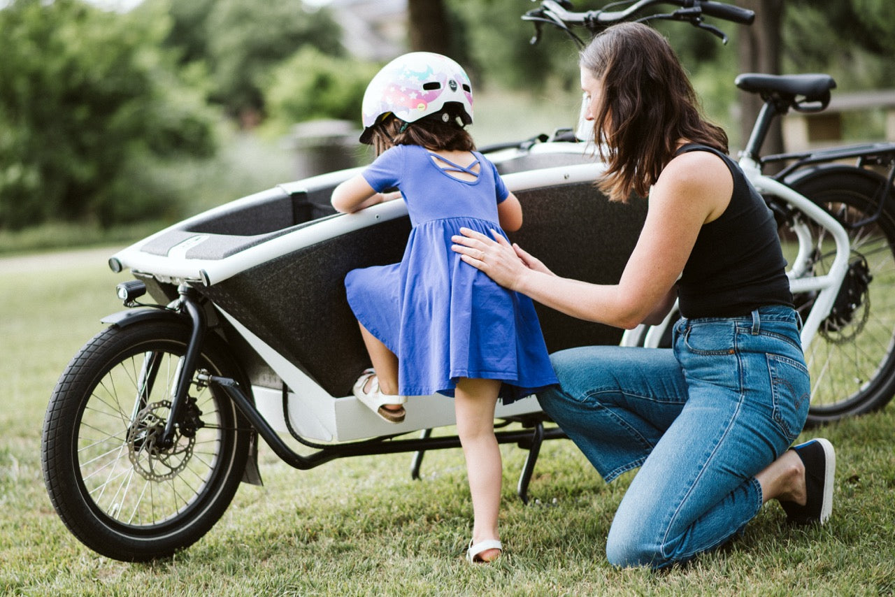 Mother and daughter getting ready to ride their Urban Arrow Family cargo bike